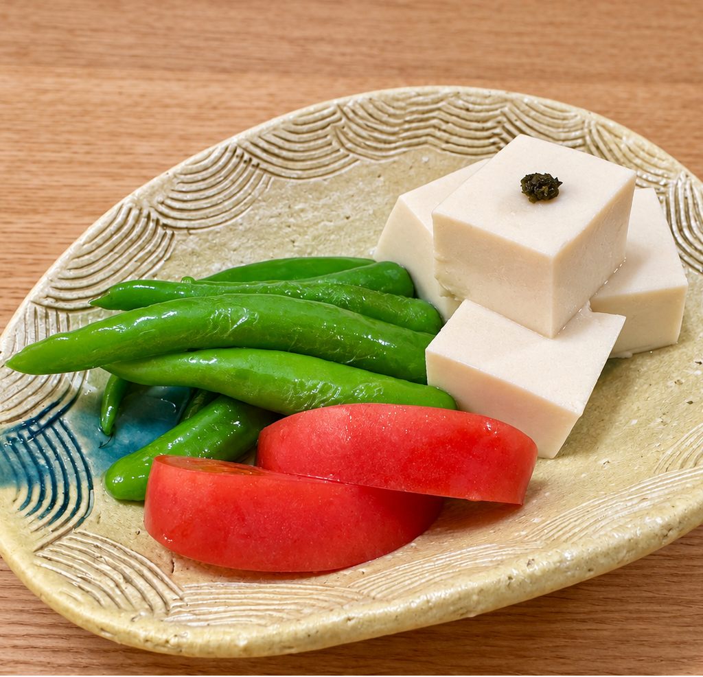 Chilled tofu topped with shiso kosho, with green peppers and tomato on the side