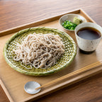 Cold soba noodles with dipping sauce and condiments — serving suggestion